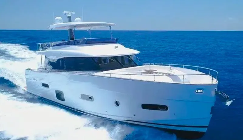 Azimut Magellano 53 Yacht Photos Pics 2020 Azimut Magellano 53 yacht cruising on open sea under clear blue sky.