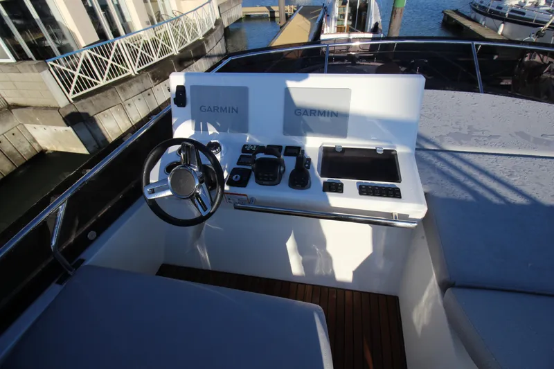  Yacht Photos Pics 2024 Prestige 520 yacht helm with Garmin navigation system and controls.