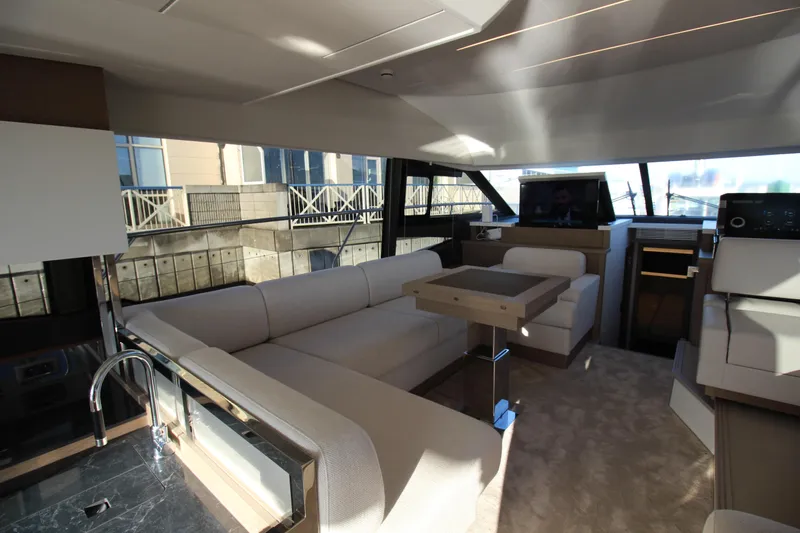  Yacht Photos Pics Luxurious interior of 2024 Prestige 520 yacht with modern seating and sleek design.
