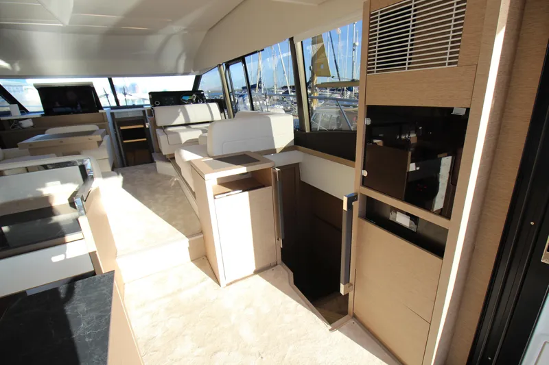  Yacht Photos Pics Luxurious interior of 2024 Prestige 520 yacht with modern furnishings and panoramic windows.