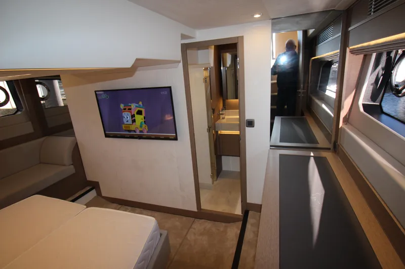  Yacht Photos Pics Luxurious interior of 2024 Prestige 520 yacht with TV and modern furnishings.