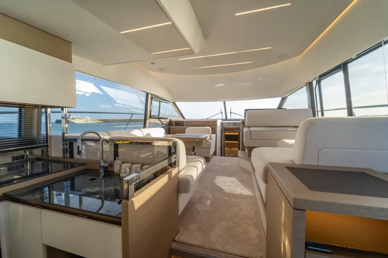  Yacht Photos Pics Luxurious interior of 2024 Prestige 520 yacht with modern design and panoramic windows.