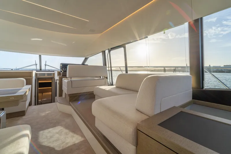  Yacht Photos Pics Luxurious interior of 2024 Prestige 520 yacht with elegant seating and panoramic windows.