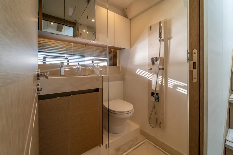  Yacht Photos Pics Luxurious bathroom in 2024 Prestige 520 yacht with modern fixtures and elegant design.