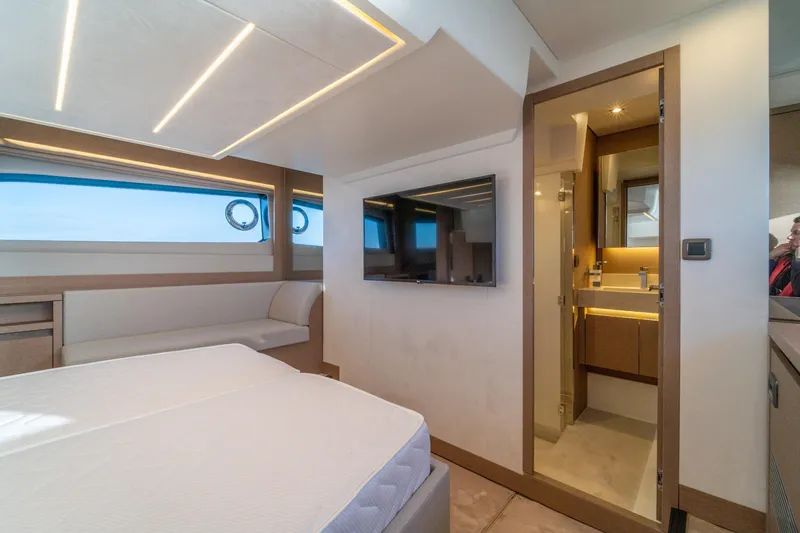  Yacht Photos Pics Luxurious interior of 2024 Prestige 520 yacht with modern bedroom and ensuite bathroom.