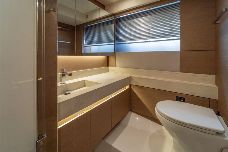  Yacht Photos Pics Luxurious bathroom in 2024 Prestige 520 yacht with modern fixtures and elegant design.