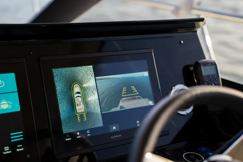  Yacht Photos Pics 2024 Prestige 520 yacht dashboard with navigation display and steering wheel.