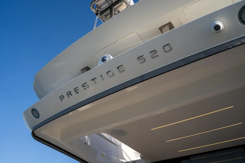  Yacht Photos Pics 2024 Prestige 520 yacht, rear view with clear blue sky background.