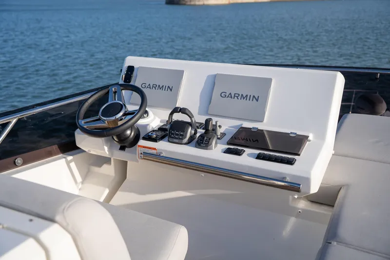  Yacht Photos Pics 2024 Prestige 520 yacht helm with Garmin navigation system on open water.