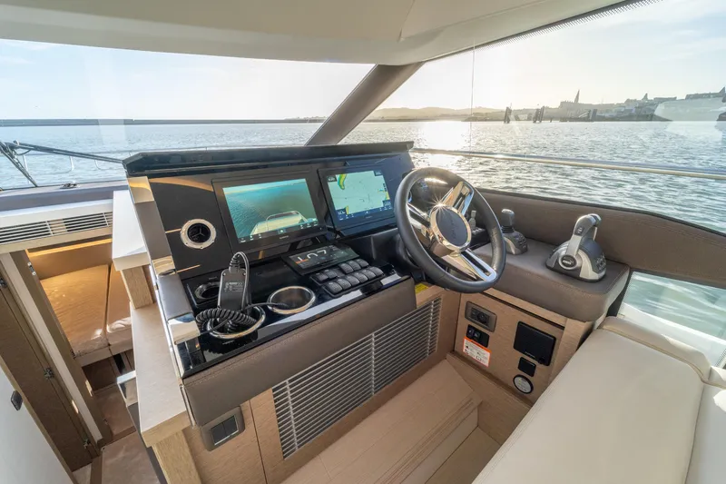  Yacht Photos Pics 2024 Prestige 520 yacht helm with modern navigation controls and panoramic sea view.