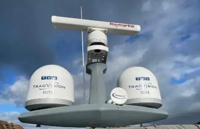 Azimut Magellano 53 Yacht Photos Pics Radar and satellite equipment on a 2020 Azimut Magellano 53 yacht under cloudy skies.