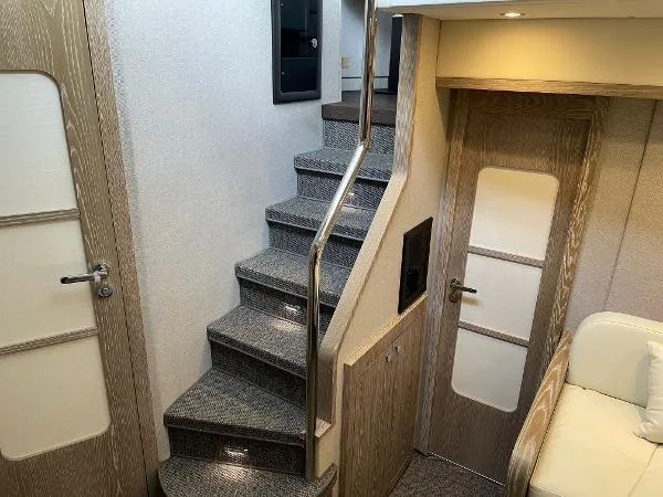 Azimut Magellano 53 Yacht Photos Pics Interior of 2020 Azimut Magellano 53 yacht with modern staircase and elegant design.