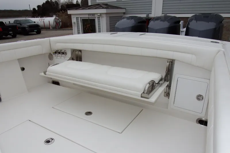  Yacht Photos Pics 2018 Regulator 34SS boat interior with foldable seating and storage compartments.