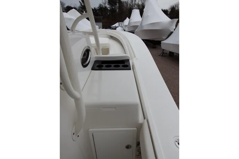  Yacht Photos Pics 2018 Regulator 34SS boat deck with rod holders, docked and covered.