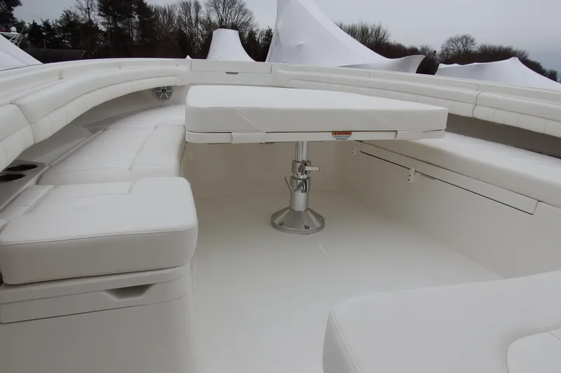  Yacht Photos Pics 2018 Regulator 34SS boat interior with white seating and table.