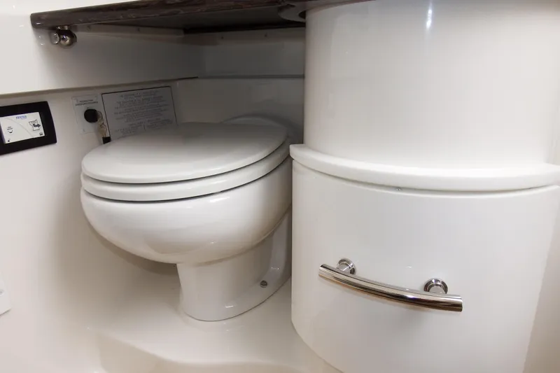  Yacht Photos Pics 2018 Regulator 34SS boat bathroom with toilet and storage compartment.