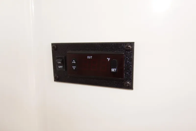  Yacht Photos Pics Control panel on 2018 Regulator 34SS boat, featuring temperature settings and on/off switch.