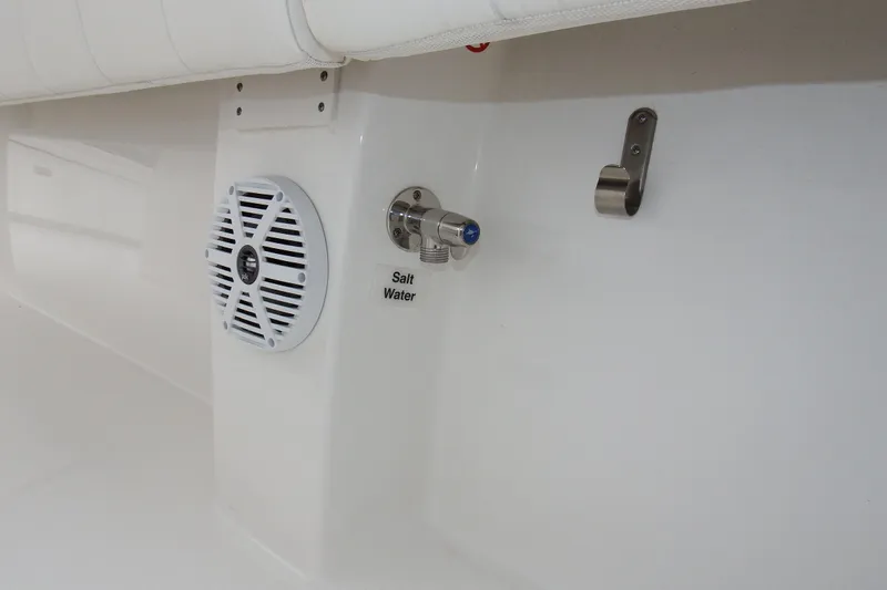  Yacht Photos Pics 2018 Regulator 34SS boat interior with speaker, saltwater faucet, and metal hook.