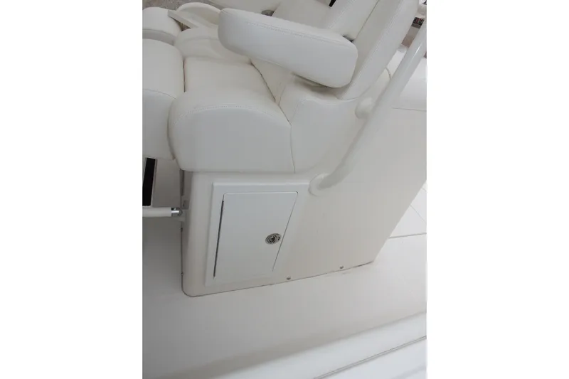  Yacht Photos Pics 2018 Regulator 34SS boat seat with storage compartment, white upholstery.