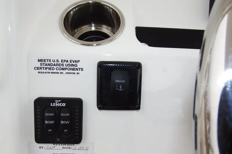  Yacht Photos Pics Control panel of a 2018 Regulator 34SS boat with Lenco and windlass switches.