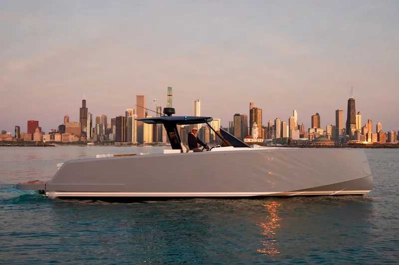  Yacht Photos Pics 2025 Pardo Yachts P43 cruising on water with city skyline backdrop.