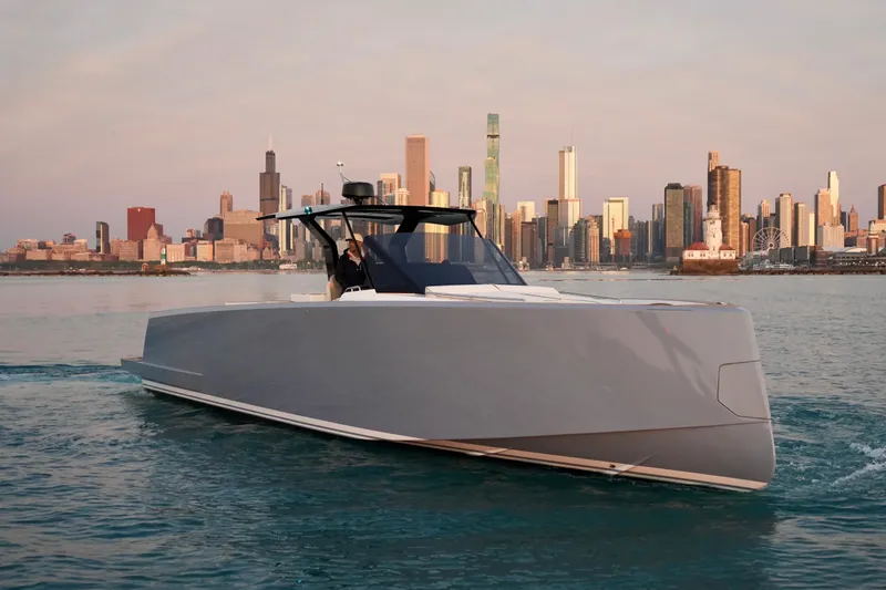  Yacht Photos Pics 2025 Pardo Yachts P43 cruising near a city skyline at sunset.