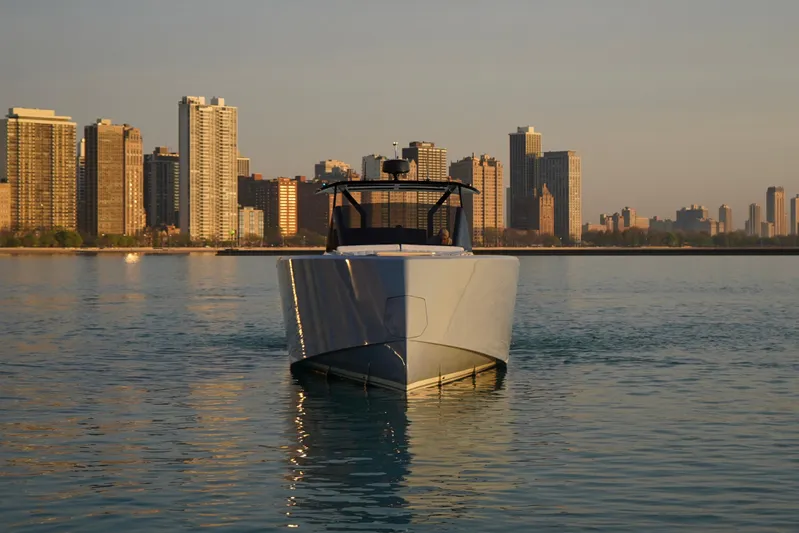  Yacht Photos Pics Pardo Yachts P43 (2025) on calm water with city skyline backdrop.