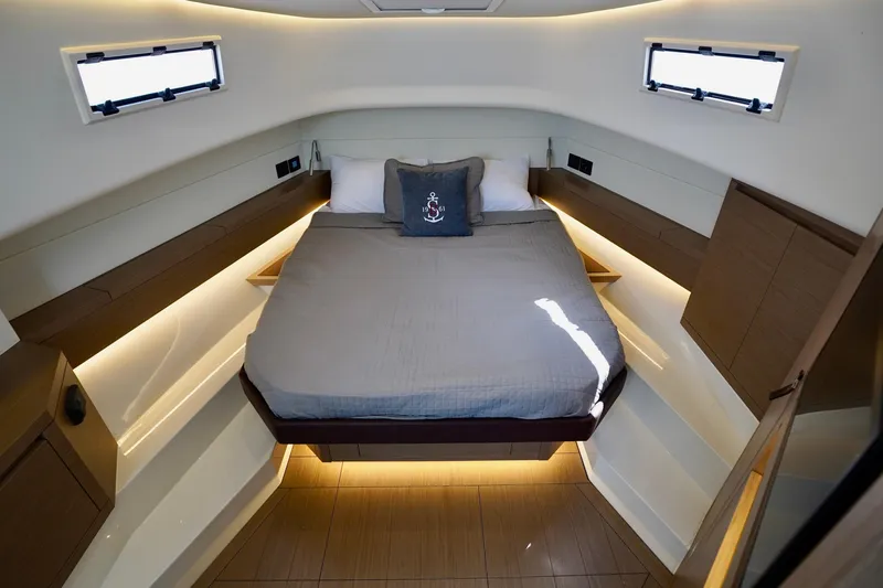  Yacht Photos Pics Luxurious cabin interior of 2025 Pardo Yachts P43 with modern lighting and cozy bed.