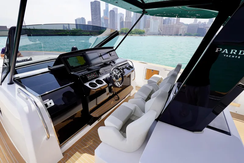  Yacht Photos Pics 2025 Pardo Yachts P43 helm with city skyline view, featuring modern controls and seating.