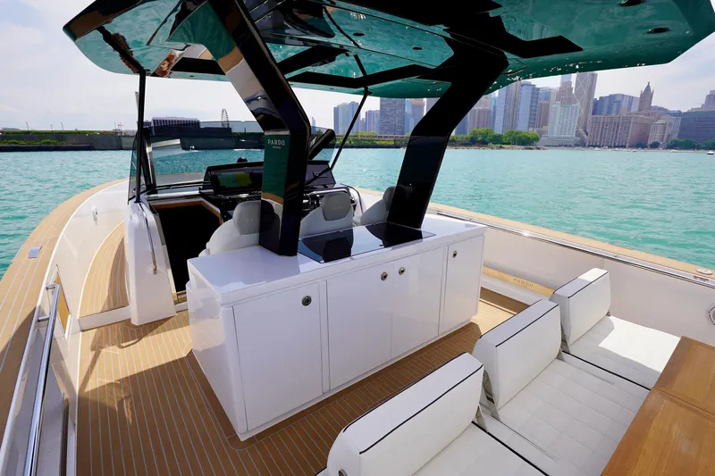  Yacht Photos Pics 2025 Pardo Yachts P43 on turquoise water with city skyline backdrop.