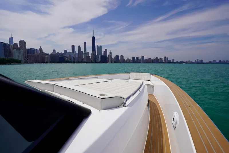  Yacht Photos Pics 2025 Pardo Yachts P43 cruising with city skyline in the background.