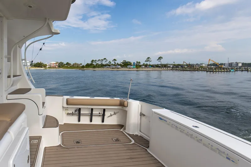 Pipe Dream Yacht Photos Pics 2008 Luhrs 35 Convertible boat deck with scenic waterfront view.