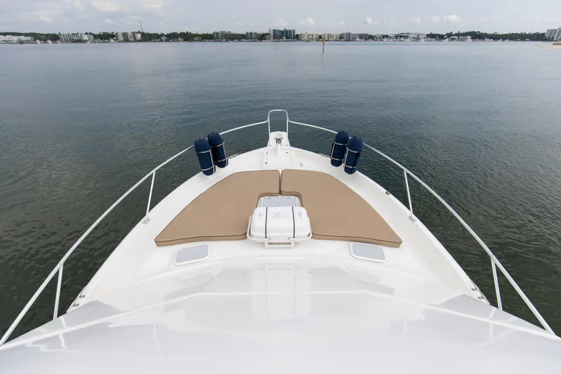 Pipe Dream Yacht Photos Pics 2008 Luhrs 35 Convertible yacht bow view on calm water.