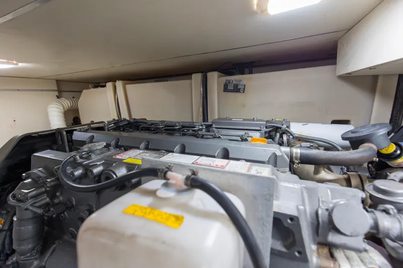 Pipe Dream Yacht Photos Pics Engine room of 2008 Luhrs 35 Convertible boat, showcasing mechanical components and piping.