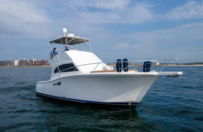 Pipe Dream Yacht Photos Pics 2008 Luhrs 35 Convertible yacht cruising on open water under a clear sky.