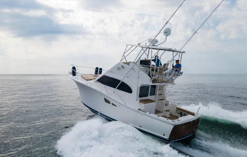 Pipe Dream Yacht Photos Pics 2008 Luhrs 35 Convertible yacht cruising on open water, showcasing sleek design and performance.