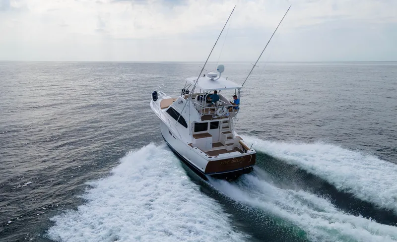 Pipe Dream Yacht Photos Pics 2008 Luhrs 35 Convertible yacht cruising on open sea.