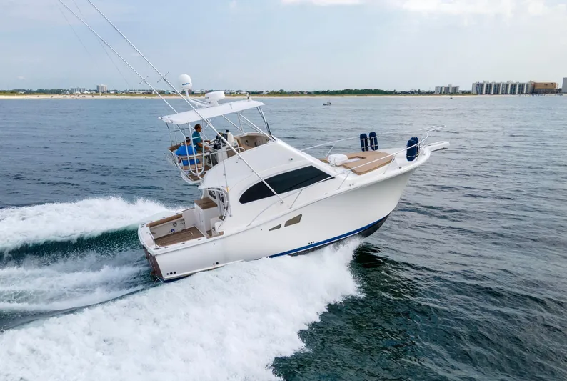 Pipe Dream Yacht Photos Pics 2008 Luhrs 35 Convertible yacht cruising on open water.
