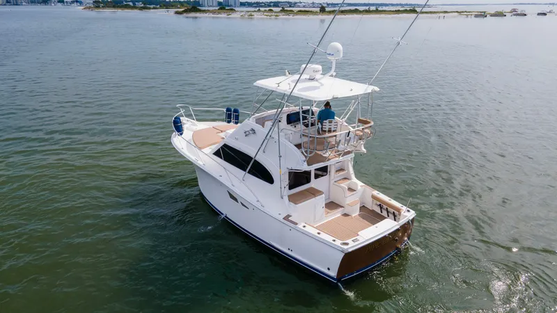 Pipe Dream Yacht Photos Pics 2008 Luhrs 35 Convertible yacht cruising on calm waters.