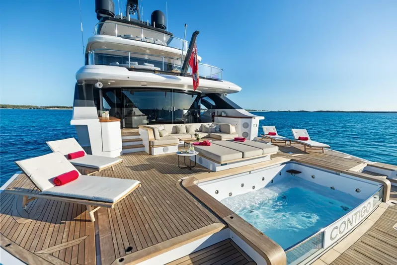 Contigo Yacht Photos Pics Luxurious 2024 Benetti 40M Oasis yacht with spacious deck and jacuzzi, cruising on serene waters.