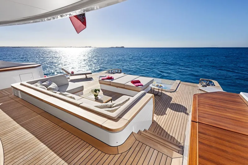 Contigo Yacht Photos Pics Luxurious 2024 Benetti 40M Oasis yacht deck with ocean view and elegant seating area.