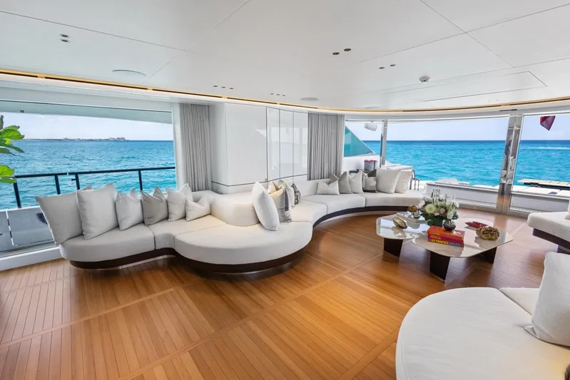 Contigo Yacht Photos Pics Luxurious interior of 2024 Benetti 40M Oasis yacht with ocean view and elegant seating.
