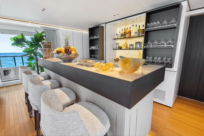 Contigo Yacht Photos Pics Luxurious bar area on 2024 Benetti 40M Oasis yacht with ocean view.