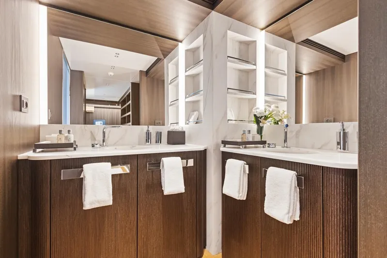 Contigo Yacht Photos Pics Luxurious bathroom in 2024 Benetti 40M Oasis yacht with modern fixtures and elegant design.