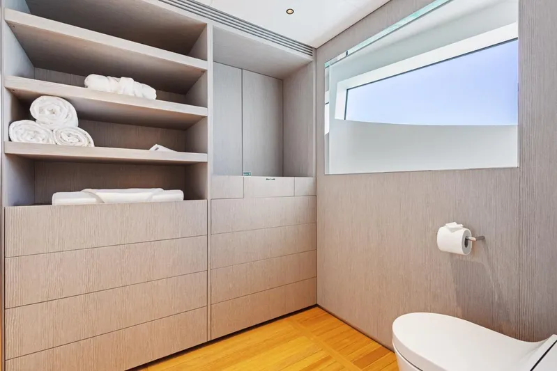 Contigo Yacht Photos Pics Luxurious bathroom on 2024 Benetti 40M Oasis yacht with modern design and ample storage.