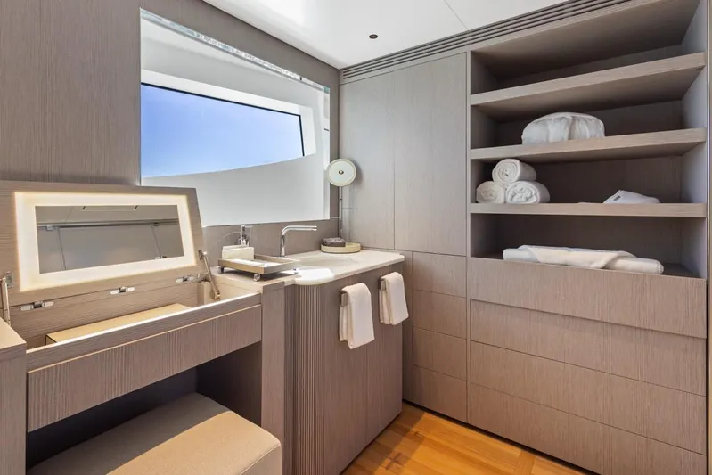 Contigo Yacht Photos Pics Luxurious bathroom in 2024 Benetti 40M Oasis yacht, featuring modern design and ample storage.