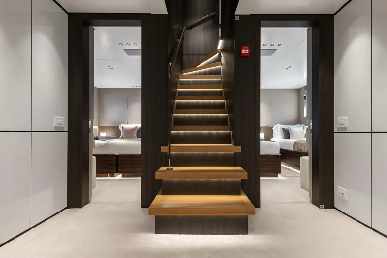 Contigo Yacht Photos Pics Luxurious interior of 2024 Benetti 40M Oasis yacht with elegant staircase and modern design.