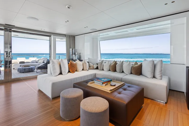 Contigo Yacht Photos Pics Luxurious interior of 2024 Benetti 40M Oasis yacht with ocean view and modern seating.
