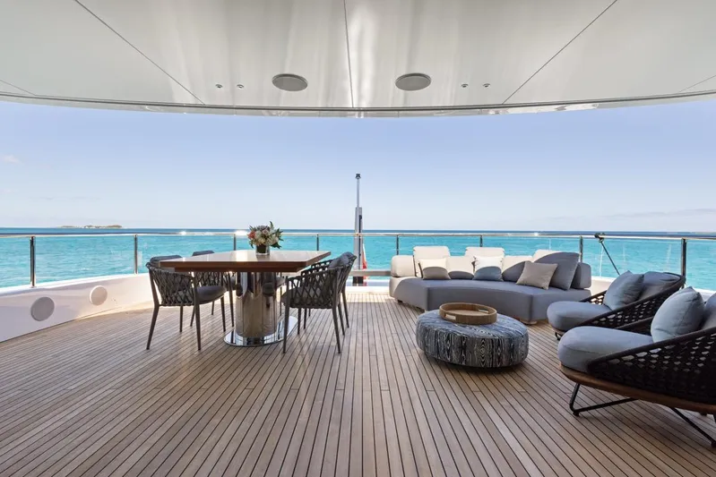 Contigo Yacht Photos Pics Luxurious deck of 2024 Benetti 40M Oasis yacht with ocean view and elegant seating.