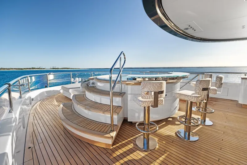 Contigo Yacht Photos Pics Luxurious 2024 Benetti 40M Oasis yacht deck with bar and ocean view.